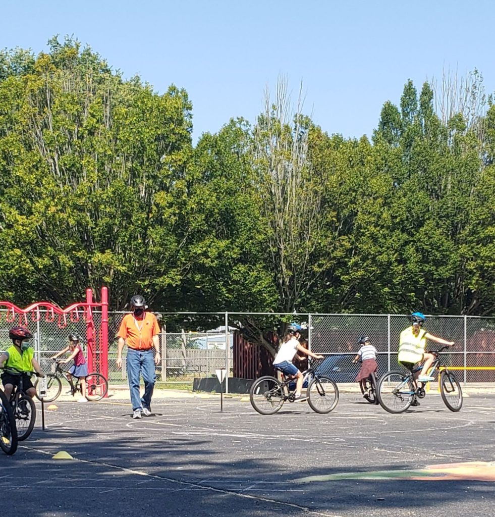Campers riding the figure 8 and learning to yield