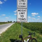 Bicycle next to Three Foot passing sign, Rantoul