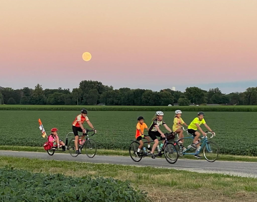 Moonlight over tandem riders