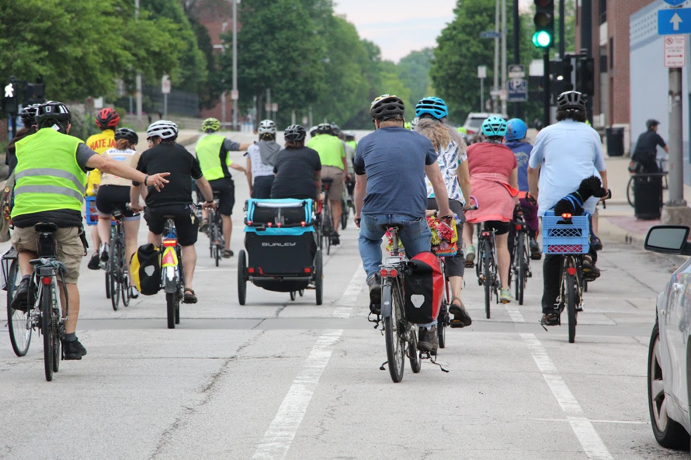 Cyclists biking down a main street.